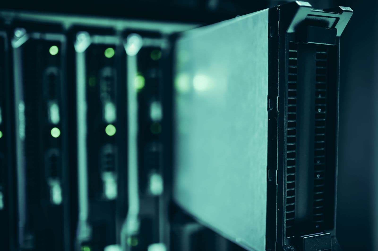 Close-up of illuminated server rack hardware in a data center